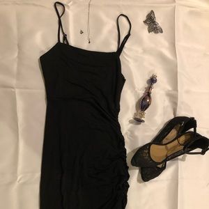 Black bodycon dress with side ruching